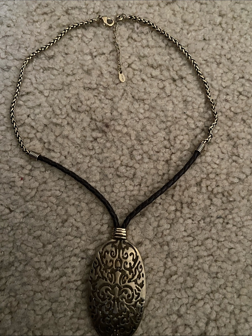 Vintage Monet necklace distinguished by a large Oval Filigree Pendant